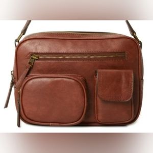 Faux leather cross body travel bag.